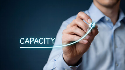 Businessman increasing capacity with marker for business growth strategy