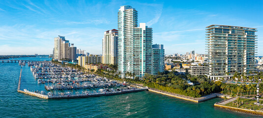 Fototapeta premium Aerial view of luxury waterfront buildings and marina in Miami