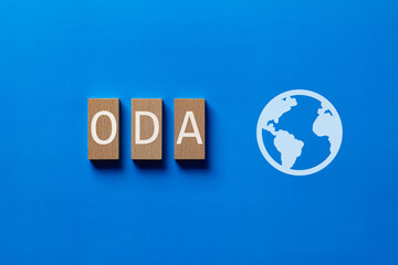ODA wood block for Finance. An abbreviation for Official Development Assistance, ideal for content...