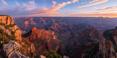 Sunset over the Grand Canyon with vibrant sky and dramatic cliffs
