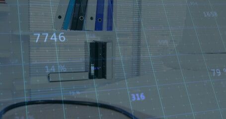 Displaying white shelving unit holding binders and files at office desk, with digital grid overlay