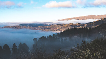 central otago hills covered in fog and low cloud beautiful winter landscape new zealand