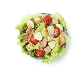 Delicious salad with croutons, chicken, quail eggs, tomato and cheese in bowl isolated on white, top view