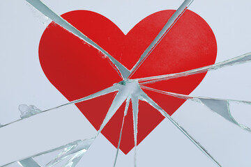 Betrayal. Broken glass with red heart, top view