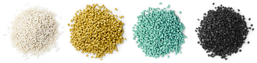 Plastic granules in different colors, top view. Piles on white background, set