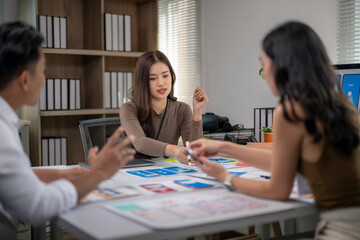 Three people are sitting at a table