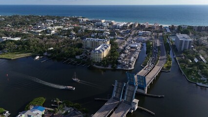 Stickney Point draw bridge raised as boaters move through the bay off of Siesta Key, Sarasota, Florida