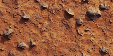 Fototapeta premium Close-up view of a textured surface of reddish-brown dirt and rocks.