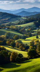 Lush Green Hills Rolling into Distant Mountains With Vibrant Autumn Trees Under a Clear Sky