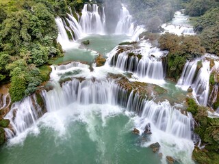 Mountain Forest Waterfall with Flowing Stream in Nature
