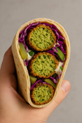 Grilled Falafel Shawarma with Cauliflower Held in Hand – AI-generated
