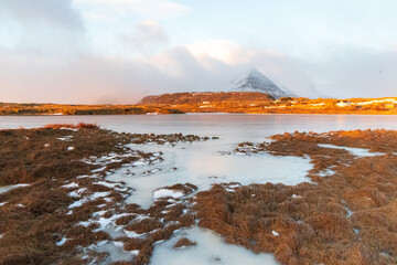 The low hanging, golden hour sun illuminates an Icelandic landscape near Djupivogur, in the south east of Iceland