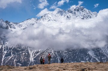 Tourist while trekking on Tsergo Ri (4,990m) the high point on the Langtang valley trek of Nepal.