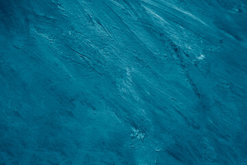 Abstract background with a textured, brushstroke style. Earthy light blue background, creating a...