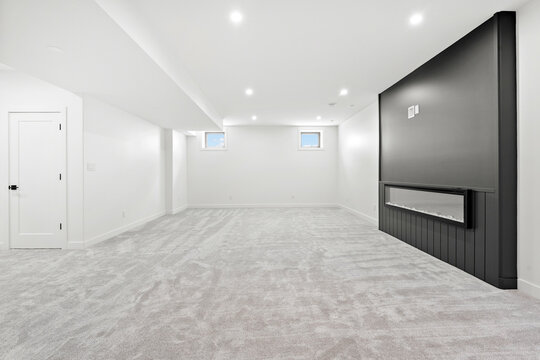 Large room with a fireplace and a television
