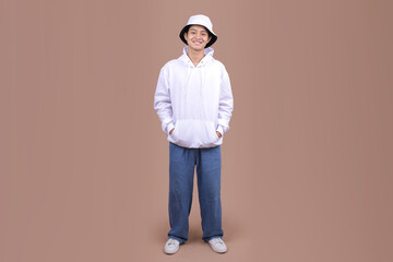 Full Body of Young Male Wearing a White Hoodie and Bucket Hat for Fashion Mockup © Gatot
