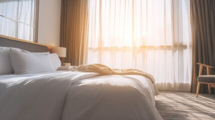 Fototapeta premium Serene hotel bedroom bathed in morning light, featuring minimalist decor and a neatly made bed. 