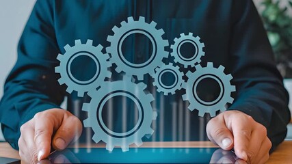 Slow rotating digital gears above a tablet held by a person. Dolly in. 4K.
 - Powered by Adobe