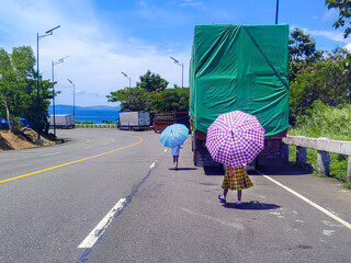 Filipino Children Walking Alone Along Curved Highway