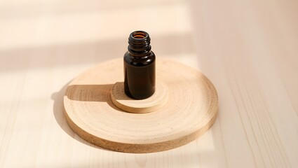 A dark amber bottle on a small wooden platform sitting on a larger round wooden platform in soft light