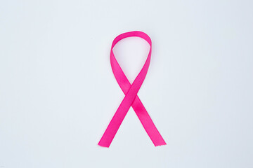 Pink ribbon on white background