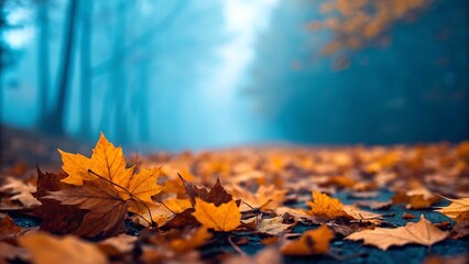 Autumn forest path covered in golden leaves with misty sunlight
