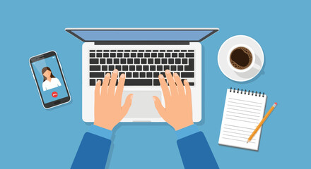 Hands are busy typing on a laptop, surrounded by essential remote work tools including a smartphone with a video call, coffee, and a notepad.