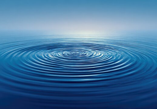 Still water ripples in a serene blue.  A gentle disturbance creates concentric circles on a vast expanse of deep blue water.  Soft light illuminates the horizon