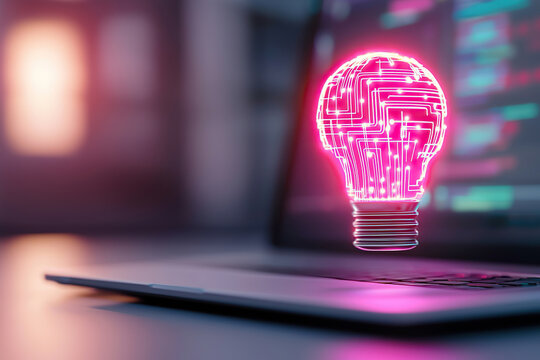Glowing light bulb with circuit patterns symbolizes innovation and technology, displayed on laptop screen
