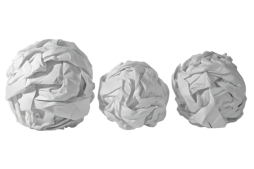 Three crumpled paper balls on black background representing writer s block concept