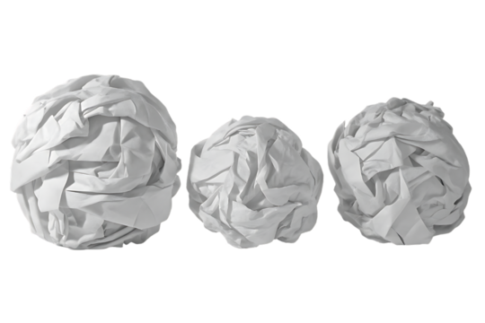Three crumpled paper balls on black background representing writer s block concept