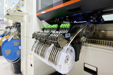 High-speed pick-and-place machines for precise PCB component placement in an industrial setting