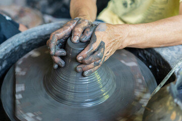The Art of Pottery, Hands Crafting Clay on a Wheel
