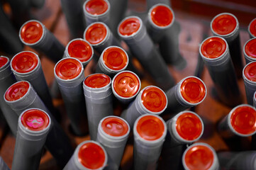 Intricate details of factory high-rise fireworks waiting for the night to light up the sky with...