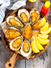 Delicious Fried Oysters on Half Shell with Lemon and Hot Sauce