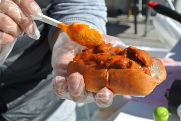 close up of a baker holding burger