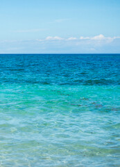 A view of crystal clear turquoise sea water that is soothing to the eyes. Background and pattern for design. Photo taken at Atauro Beach, Timor Leste.