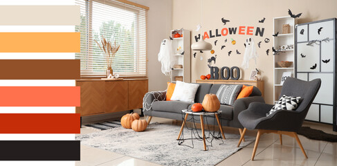 Interior of stylish living room decorated for Halloween with ghosts and pumpkins