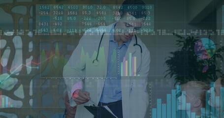 Leaning physician wearing lab coat and stethoscope reviewing digital charts on clipboard in clinic