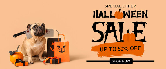 Cute French bulldog with axe, pumpkin, Halloween gift boxes and shopping bags sitting on beige...