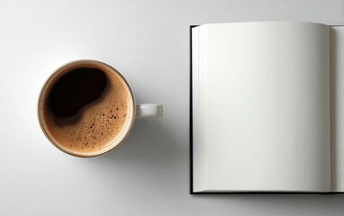 Black coffee in a cup next to an open blank notebook on white background