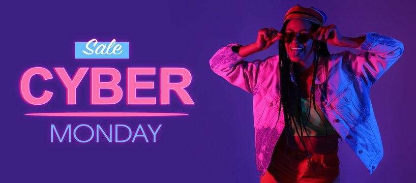 Cool young African-American woman on color background. Banner for Cyber Monday