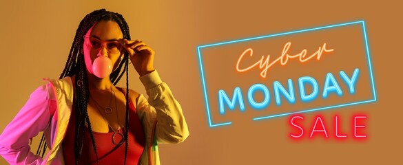 Cool young African-American woman with chewing gum on color background. Banner for Cyber Monday