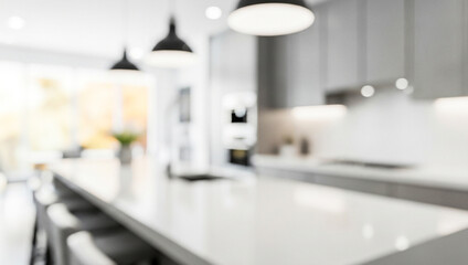 Blurred view of a modern kitchen interior with white countertops and black pendant lights.Premium modern kitchen photos for professional poster, banner and brochure designs