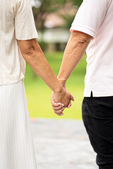 Couple, back and holding hands outdoor.