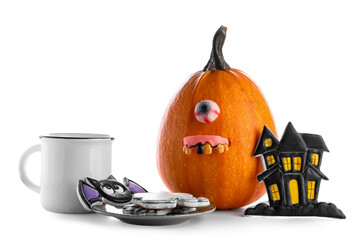 Plate with tasty cookies, cup of milk and pumpkin for Halloween celebration on white background