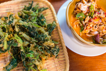 Spicy crispy morning glory salad (Yum Pak Boong Grob), is a tasty salad dish with fried morning glory and a savory spicy Thai sauce
