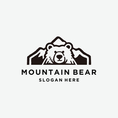 Dynamic mountain bear logo combining nature and power.