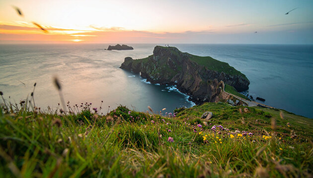 Majestic sunset over a rugged coastal headland with ancient ruins and wildflowers - Powered by Adobe