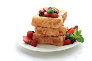 French Toast with Strawberries, Blackberry, Raspberry, and a Fresh Mint Leaf